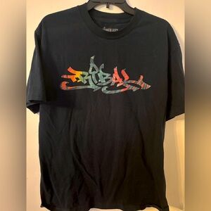 Lower Left, Tribal Tee, L, black w/ colorful graffiti letters. LL logo on back.